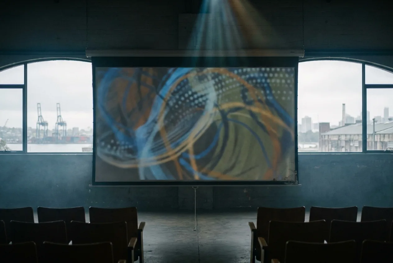 Projected slide pattern on a conference screen with ambient haze